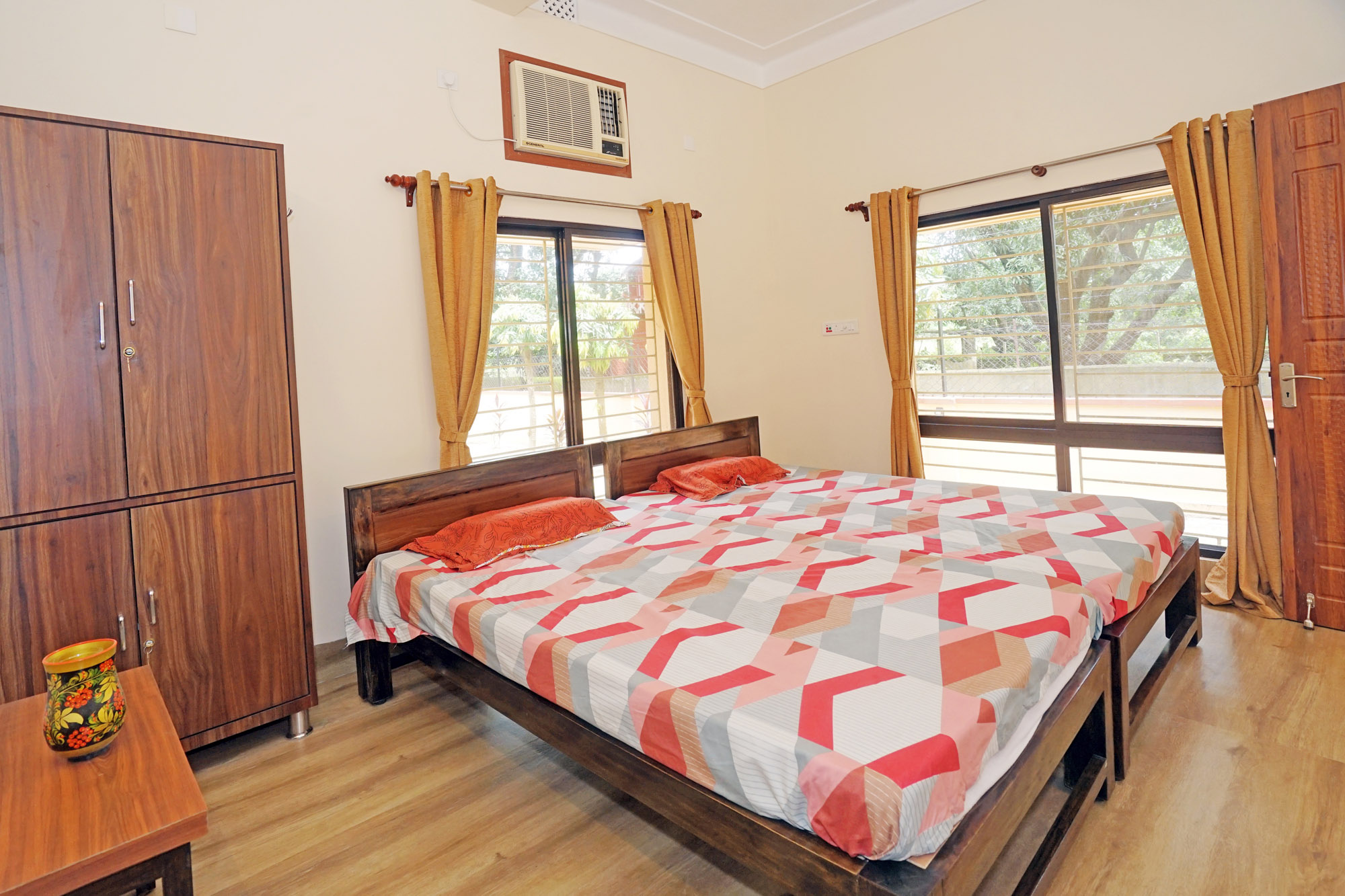 Another view of deluxe bedroom and wardrobe.